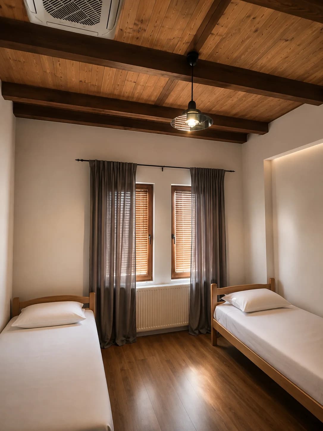 Twin bedroom with timber ceiling and two single beds